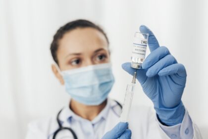 close up woman with syringe serum