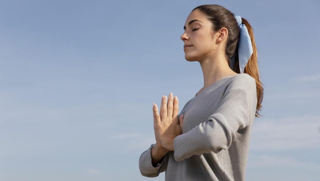 side view woman meditating nature 1